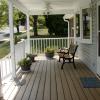 Front porch with exterior fans, vinyl railings, and composite decking